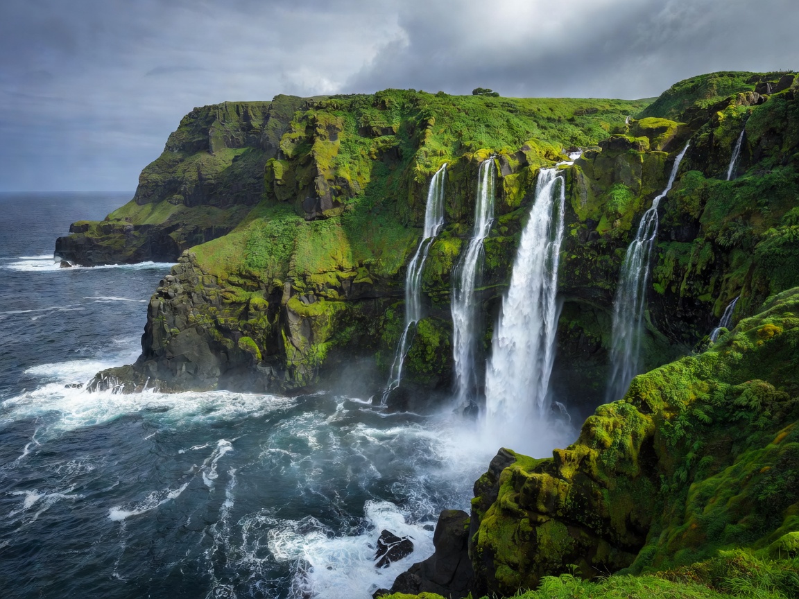 Flores Island coastal waterfalls and green cliffs Azores